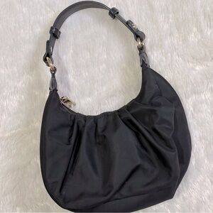 Black Fashion Nova shoulder bag purse with gold hardware.